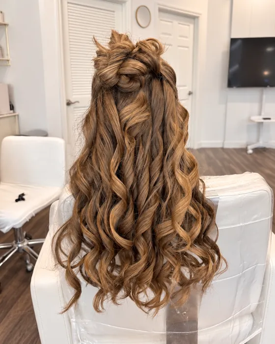 Long soft curls styled at Issa Beauty Studio